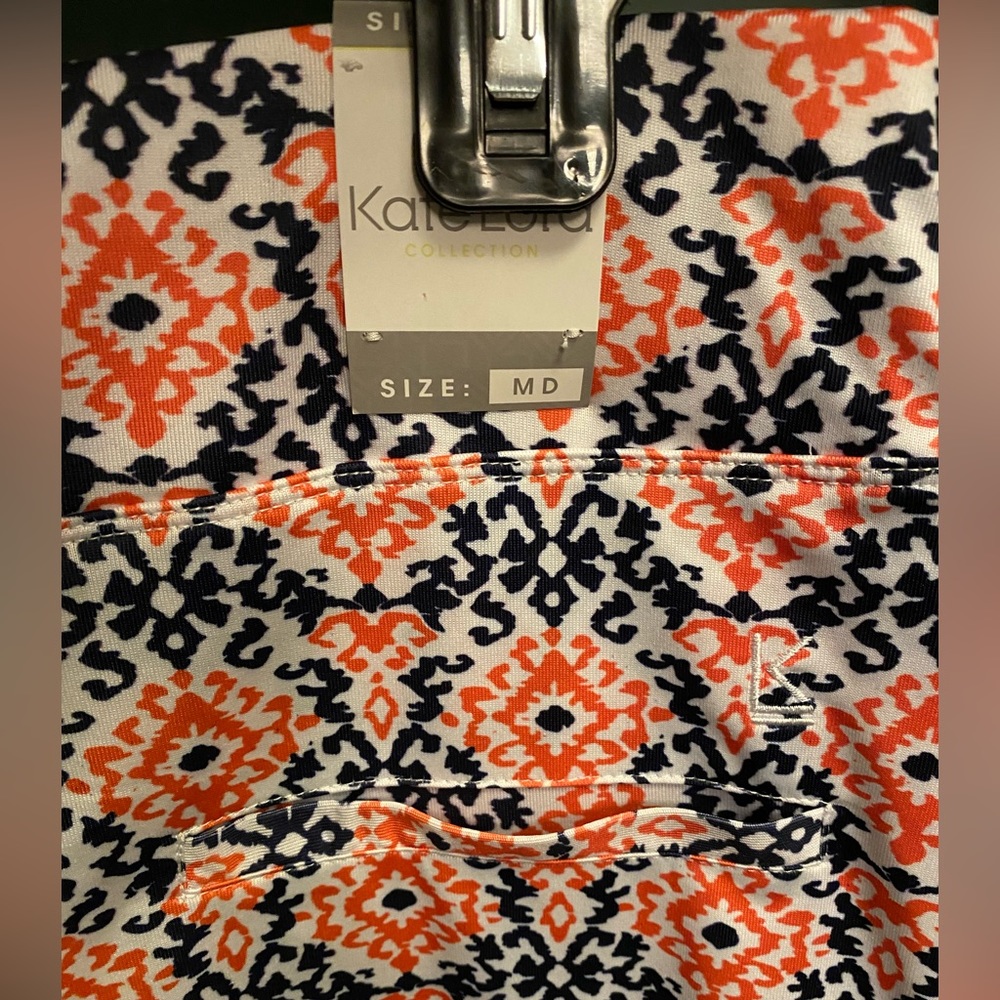 Kate Lord Golf- navy and orange skort